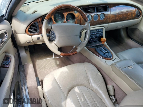 2002 Jaguar XK with VIN SAJDA42C22NA23724, listed as a Copart auction lot 53521005 with 61,468 mi miles and Salvage Title. Bid and sale history available at DreamBid. Image 8.