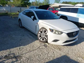 2014 Mazda Mazda6 i Touring with VIN JM1GJ1V65E1117072, listed as a IAAI auction lot 42060743 with 181,524 mi miles. Bid and sale history available at carsss.com. Image 1.