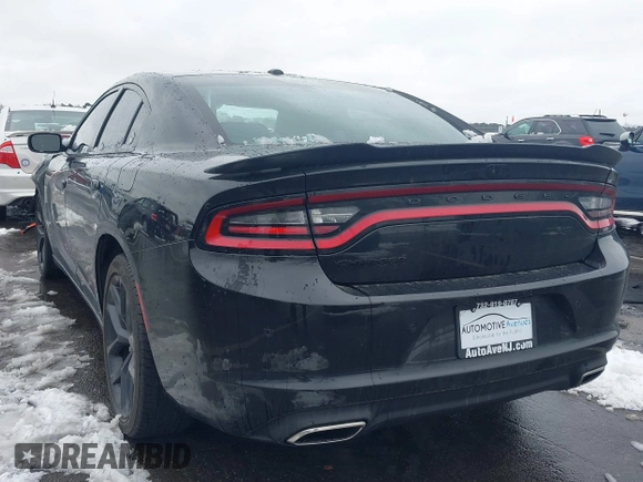 2022 Dodge Charger SXT with VIN 2C3CDXBG0NH157720, listed as a IAAI auction lot 41559731 with 21,062 mi miles and . Bid and sale history available at carsss.com. Image 3.