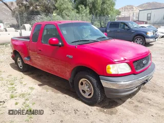 2002 Ford F-150 XL with VIN 2FTRX07222CA26864, listed as a IAAI auction lot 42247820 with 216,705 mi miles and . Bid and sale history available at DreamBid. Image 1.