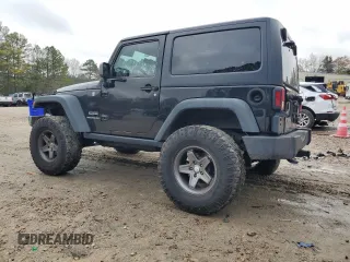 2015 Jeep Wrangler Sport with VIN 1C4AJWAG7FL576076, listed as a Copart auction lot 84072324 with 100,119 mi miles and Salvage Title. Bid and sale history available at carsss.com. Image 2.