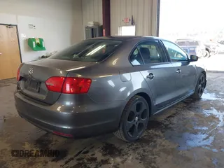 2014 Volkswagen Jetta Sedan S with VIN 3VW2K7AJ5EM410491, listed as a IAAI auction lot 42083614 with 65,960 mi miles. Bid and sale history available at carsss.com. Image 4.