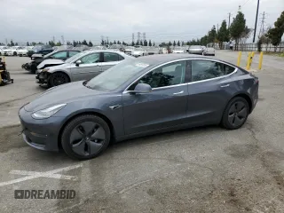 2018 Tesla Model 3 Long Range Battery z VIN 5YJ3E1EB5JF150719, wystawiony jako Copart lot #53497015 z przebiegiem Nie podano mil oraz Szkody całkowita. Historia ofert i sprzedaży dostępna na DreamBid. Obrazek 1.