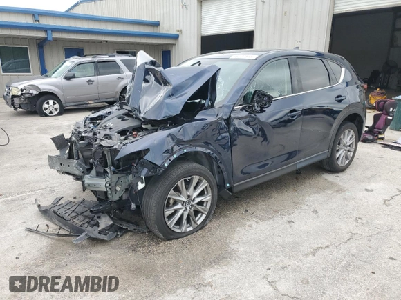 2021 Mazda CX-5 Grand Touring with VIN JM3KFADM9M0401778, listed as a Copart auction lot 46227515 with 44,587 mi miles and Non Repairable. Bid and sale history available at carsss.com. Image 1.