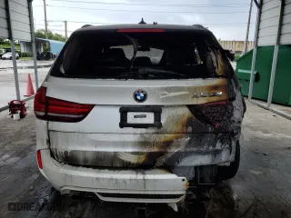 2015 BMW X5 M with VIN 5YMKT6C55F0C89468, listed as a Copart auction lot 75391074 with 0 mi miles and Salvage Title. Bid and sale history available at carsss.com. Image 6.