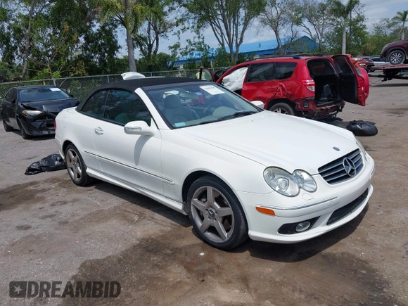 2005 Mercedes-Benz CLK 5.0L with VIN WDBTK75J55F123328, listed as a IAAI auction lot 42082590 with 58,969 mi miles. Bid and sale history available at carsss.com. Image 1.