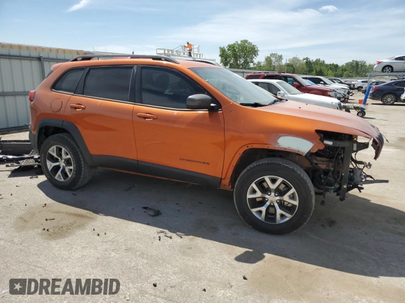 2015 Jeep Cherokee Trailhawk with VIN 1C4PJMBS5FW523019, listed as a Copart auction lot 55527955 with 107,503 mi miles and Salvage title. Bid and sale history available at DreamBid. Image 4.