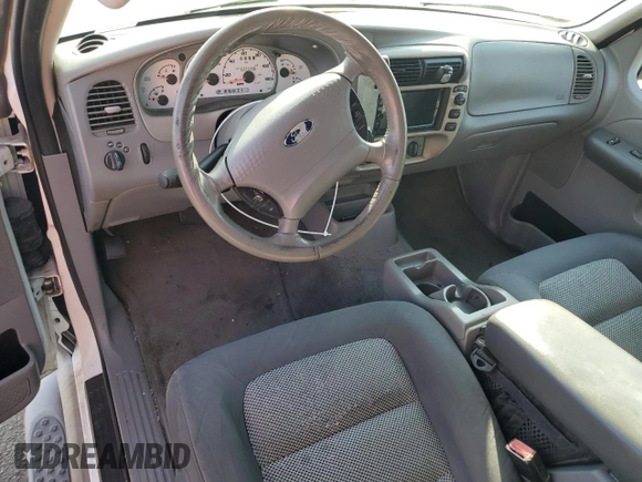 2003 Ford Explorer Sport XLS z VIN 1FMYU60E03UB97766, wystawiony jako Copart lot #82920774 z przebiegiem 131 273 mil mil oraz Tytuł czysty. Historia ofert i sprzedaży dostępna na DreamBid. Obrazek 8.