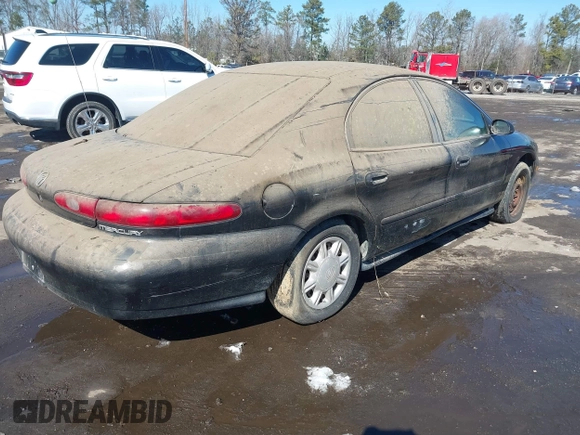 1997 Mercury Sable GS with VIN 1MELM50U7VA656293, listed as a IAAI auction lot 41651281 with 136,024 mi miles and . Bid and sale history available at DreamBid. Image 4.