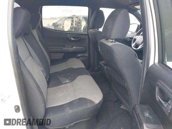 2022 Toyota Tacoma SR z VIN 3TMCZ5AN7NM493268, wystawiony jako IAAI lot #42041593 z przebiegiem 100 589 mil mil oraz . Historia ofert i sprzedaży dostępna na DreamBid. Obrazek 8.