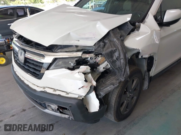 2020 Honda Ridgeline RTL-E with VIN 5FPYK3F71LB005028, listed as a IAAI auction lot 42167883 with 81,882 mi miles and . Bid and sale history available at DreamBid. Image 6.