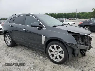 2015 Cadillac SRX Performance Collection with VIN 3GYFNCE38FS597717, listed as a Copart auction lot 57629615 with 102,689 mi miles and Salvage title. Bid and sale history available at DreamBid. Image 4.
