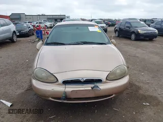 1997 Mercury Sable LS z VIN 1MELM53S8VA602057, wystawiony jako IAAI lot #41468005 z przebiegiem 71 203 mil mil oraz . Historia ofert i sprzedaży dostępna na DreamBid. Obrazek 12.