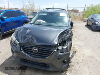 2016 Mazda CX-5 Grand Touring with VIN JM3KE4DY7G0643643, listed as a IAAI auction lot 42077497 with 120,343 mi miles and . Bid and sale history available at carsss.com. Image 12.