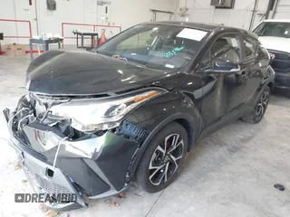 2020 Toyota C-HR LE with VIN JTNKHMBX1L1077957, listed as a IAAI auction lot 42159765 with 83,138 mi miles and . Bid and sale history available at DreamBid. Image 2.