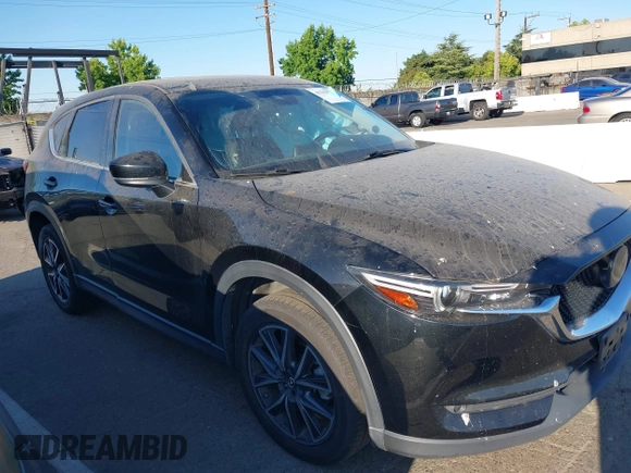 2018 Mazda CX-5 Grand Touring with VIN JM3KFBDM1J0345014, listed as a IAAI auction lot 42703926 with 151,453 mi miles and . Bid and sale history available at DreamBid. Image 13.
