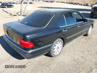 1997 Mercedes-Benz E-Class with VIN WDBJF55F6VJ032691, listed as a IAAI auction lot 40807926 with 215,262 mi miles. Bid and sale history available at carsss.com. Image 4.