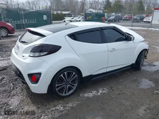 2016 Hyundai Veloster Turbo with VIN KMHTC6AE6GU275727, listed as a IAAI auction lot 41743920 with 94,893 mi miles. Bid and sale history available at carsss.com. Image 4.
