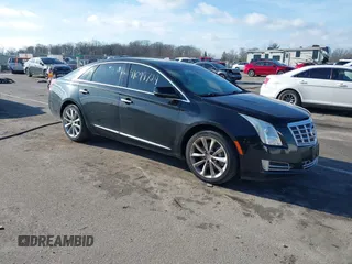 2014 Cadillac XTS Luxury z VIN 2G61N5S32E9124801, wystawiony jako IAAI lot #41099729 z przebiegiem 173 038 mil mil oraz . Historia ofert i sprzedaży dostępna na DreamBid. Obrazek 1.