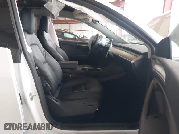 2023 Tesla Model Y Long Range z VIN 7SAYGDEE2PF834036, wystawiony jako IAAI lot #41933120 z przebiegiem 27 872 mil mil oraz . Historia ofert i sprzedaży dostępna na DreamBid. Obrazek 5.