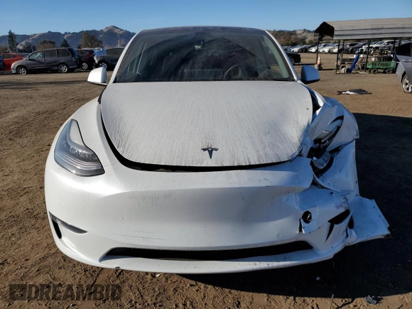 2020 Tesla Model Y Long Range with VIN 5YJYGDEE4LF015455, listed as a Copart auction lot 84223984 with 77,398 mi miles and Salvage Title. Bid and sale history available at DreamBid. Image 5.