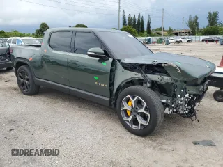 2023 Rivian R1T Adventure z VIN 7FCTGAAA8PN001040, wystawiony jako Copart lot #71517874 z przebiegiem 19 789 mil mil oraz Szkody całkowita. Historia ofert i sprzedaży dostępna na DreamBid. Obrazek 4.