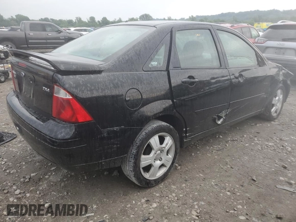 2005 Ford Focus S with VIN 1FAFP34N45W285454, listed as a Copart auction lot 59043485 with 165,071 mi miles and Salvage title. Bid and sale history available at DreamBid. Image 3.
