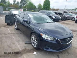 2016 Mazda Mazda6 i Touring with VIN JM1GJ1V59G1402867, listed as a IAAI auction lot 41998212 with 135,724 mi miles. Bid and sale history available at carsss.com. Image 1.