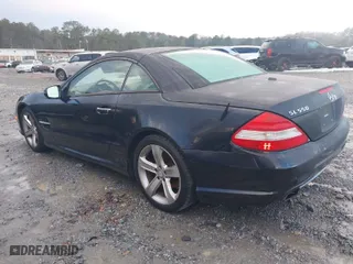 2009 Mercedes-Benz SL-Class V8 with VIN WDBSK71F29F143653, listed as a IAAI auction lot 41310556 with 115,377 mi miles. Bid and sale history available at carsss.com. Image 3.