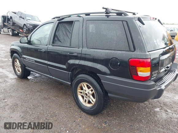 2004 Jeep Grand Cherokee Laredo with VIN 1J4GW48S74C390569, listed as a IAAI auction lot 42384503 with 191,530 mi miles and . Bid and sale history available at DreamBid. Image 3.