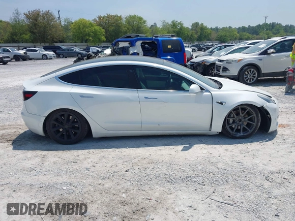 2019 Tesla Model 3 Long Range with VIN 5YJ3E1EB4KF494432, listed as a IAAI auction lot 42009327 with 121,954 mi miles and . Bid and sale history available at DreamBid. Image 13.