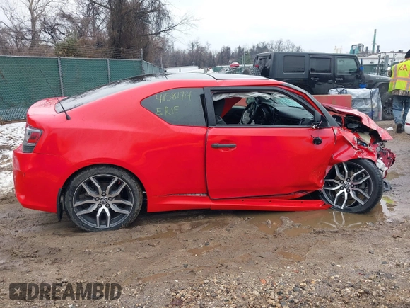 2015 Scion tC z VIN JTKJF5C79FJ013303, wystawiony jako IAAI lot #41581714 z przebiegiem Nie podano mil oraz . Historia ofert i sprzedaży dostępna na DreamBid. Obrazek 13.