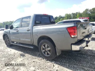 2014 Nissan Titan SV with VIN 1N6BA0ED0EN517002, listed as a Copart auction lot 57885435 with 139,910 mi miles and Salvage title. Bid and sale history available at DreamBid. Image 2.