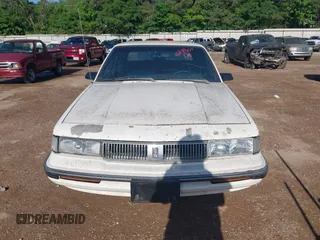 1992 Oldsmobile Cutlass Ciera with VIN 1G3AL54N4N6417365, listed as a IAAI auction lot 42074800 with 306,884 mi miles and . Bid and sale history available at DreamBid. Image 6.