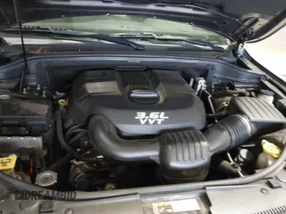 2014 Jeep Grand Cherokee Laredo with VIN 1C4RJEAG7EC145023, listed as a IAAI auction lot 40518825 with 115,098 mi miles and . Bid and sale history available at DreamBid. Image 10.