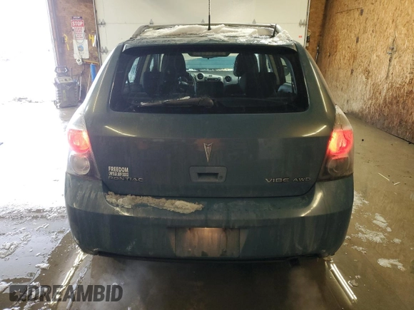 2009 Pontiac Vibe with VIN 5Y2SM67049Z437840, listed as a Copart auction lot 87366354 with 174,875 mi miles and Salvage Title. Bid and sale history available at carsss.com. Image 6.
