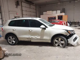 2011 Volkswagen Touareg Sport with VIN WVGFF9BP8BD004747, listed as a IAAI auction lot 41780515 with 159,228 mi miles and . Bid and sale history available at DreamBid. Image 13.