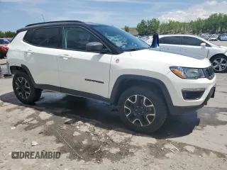 2020 Jeep Compass Trailhawk with VIN 3C4NJDDB1LT189240, listed as a Copart auction lot 57876235 with 70,309 mi miles and Salvage title. Bid and sale history available at DreamBid. Image 4.