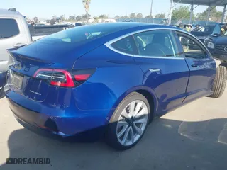 2019 Tesla Model 3 Long Range with VIN 5YJ3E1EB3KF497841, listed as a IAAI auction lot 41969728 with 21,127 mi miles. Bid and sale history available at carsss.com. Image 4.