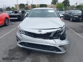 2019 Kia Optima LX with VIN 5XXGT4L3XKG285486, listed as a IAAI auction lot 41872981 with 101,981 mi miles. Bid and sale history available at carsss.com. Image 12.