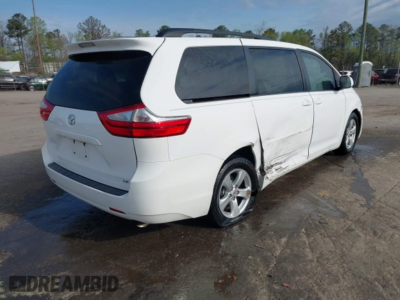 2015 Toyota Sienna LE AAS with VIN 5TDKK3DC2FS590667, listed as a IAAI auction lot 41997673 with 169,828 mi miles. Bid and sale history available at carsss.com. Image 4.