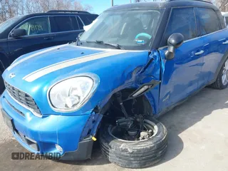 2014 MINI Countryman S with VIN WMWZC5C54EWM17299, listed as a IAAI auction lot 41655370 with 104,264 mi miles and . Bid and sale history available at DreamBid. Image 6.