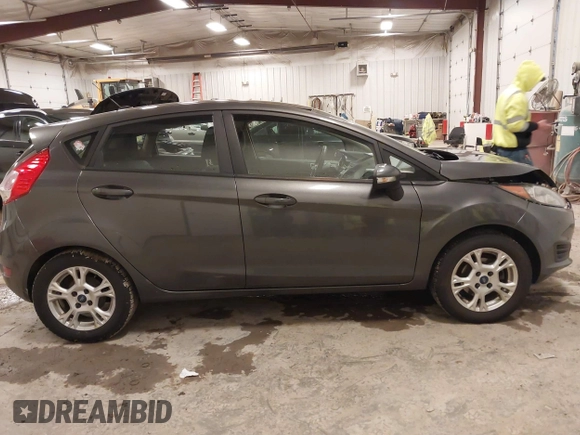 2015 Ford Fiesta SE z VIN 3FADP4EJ8FM138306, wystawiony jako IAAI lot #41227124 z przebiegiem 106 741 mil mil oraz . Historia ofert i sprzedaży dostępna na DreamBid. Obrazek 13.