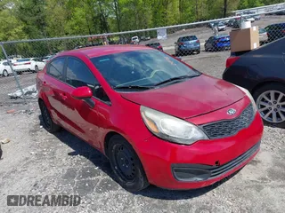 2015 Kia Rio LX with VIN KNADM4A33F6427021, listed as a IAAI auction lot 42011458 with 184,738 mi miles. Bid and sale history available at carsss.com. Image 1.