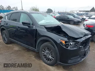 2021 Mazda CX-5 Touring with VIN JM3KFACM5M0314557, listed as a IAAI auction lot 41778401 with 31,938 mi miles. Bid and sale history available at carsss.com. Image 1.