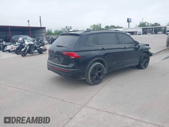 2023 Volkswagen Tiguan SE R-Line Black with VIN 3VVCB7AX1PM106543, listed as a IAAI auction lot 41784559 with 39,846 mi miles and . Bid and sale history available at DreamBid. Image 4.