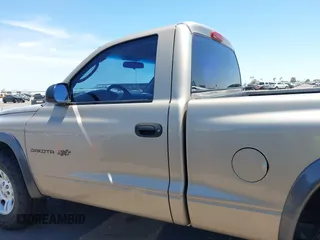 2002 Dodge Dakota with VIN 1B7FL16X72S642881, listed as a IAAI auction lot 42153560 with 220,917 mi miles and . Bid and sale history available at carsss.com. Image 14.