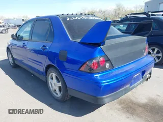2002 Mitsubishi Lancer OZ-Rally with VIN JA3AJ86E82U068706, listed as a IAAI auction lot 41820754 with 133,843 mi miles. Bid and sale history available at carsss.com. Image 3.