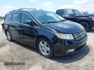 2013 Honda Odyssey Touring with VIN 5FNRL5H92DB013323, listed as a IAAI auction lot 42461330 with 120,133 mi miles and . Bid and sale history available at DreamBid. Image 1.
