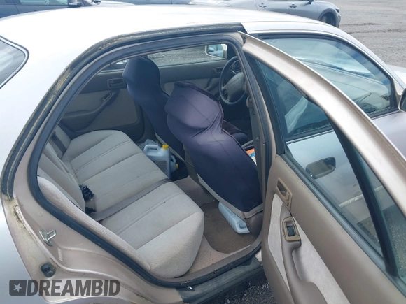 1996 Toyota Camry DX z VIN 4T1BG12K8TU754331, wystawiony jako IAAI lot #42305723 z przebiegiem 152 709 mil mil oraz . Historia ofert i sprzedaży dostępna na DreamBid. Obrazek 8.
